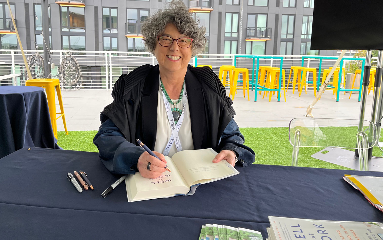 Dr. Sternberg signs her new book WELL at WORK: Creating Wellbeing in Any Workspace (Little, Brown Spark) at sold-out book signing at WELL Summit in Washington, DC, Sept. 2023.